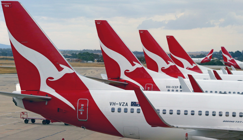 MELBOURNE, AUSTRALIA - FEBRUARY 25:  Qantas aeroplanes wait at Melbourne Tullamarine Airport on February 25, 2014 in Melbourne, Australia. On Thursday Qantas will announce their half year results, media reports suggest part of those announcements will include a large number of job cuts and the sale of their Melbourne terminal.  (Photo by Scott Barbour/Getty Images)