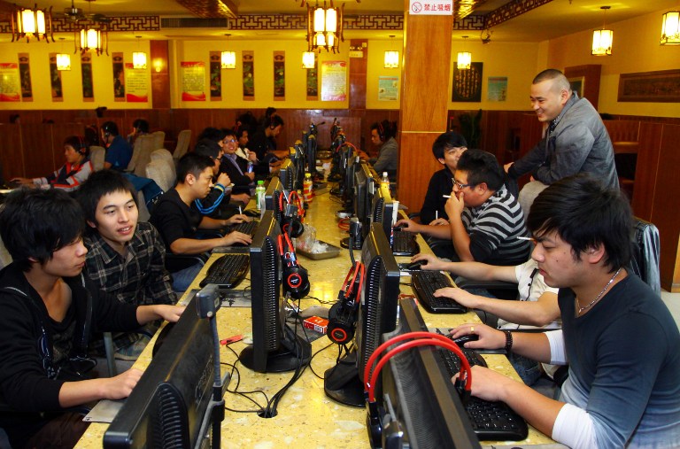 TO GO WITH China-politics-congress-Internet,FOCUS by Tom Hancock This picture taken on November 2, 2012 shows a group of people at an Internet cafe in Jiashan, east China's Zhejiang province. China has witnessed explosive growth in Internet usage since the last Communist Party transition in 2002, with the online community of 538 million posing a huge challenge to the party's attempts to shape public opinion. CHINA OUT AFP PHOTO